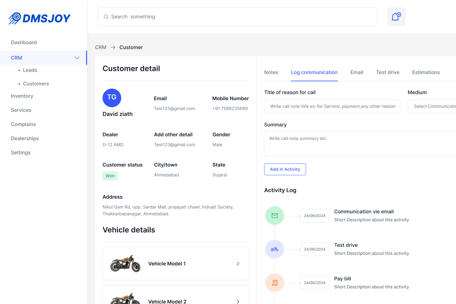 The DMSJoy customer detail screen, with contact details, an activity log and vehicle records