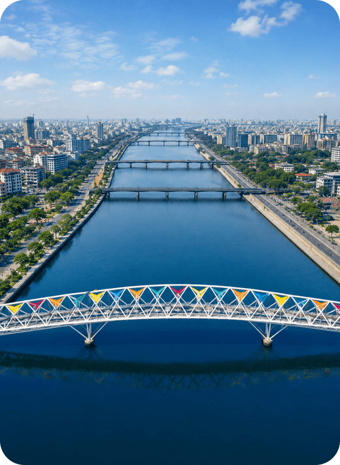 The Sabarmati riverfront in Ahmedabad at dusk, the Atal footbridge arching across the water